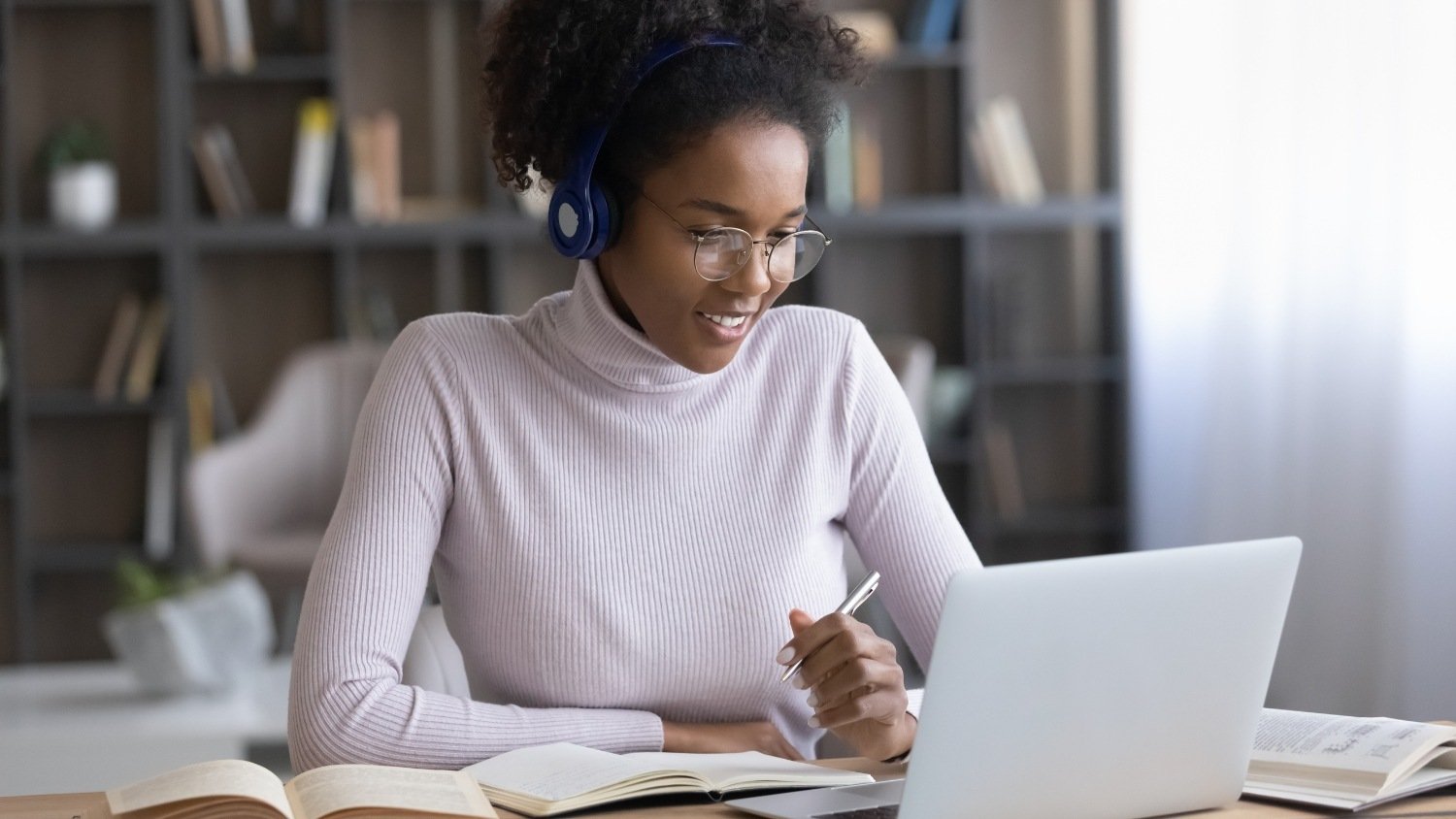 Person studying digital marketing concepts on a laptop, representing business owners learning marketing before hiring an agency