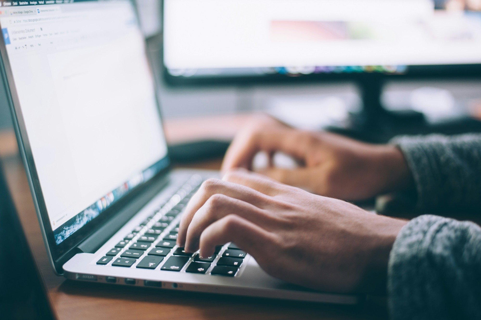 Hands-typing-on-a-laptop-to-create-a-blog-that-ranks-high-on-Google