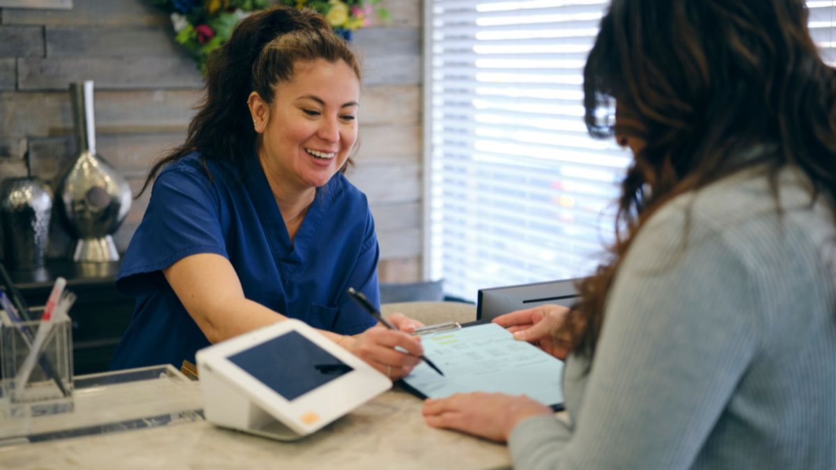 Clinic administrator confirming appointments generated from physio clinic Meta ads leads
