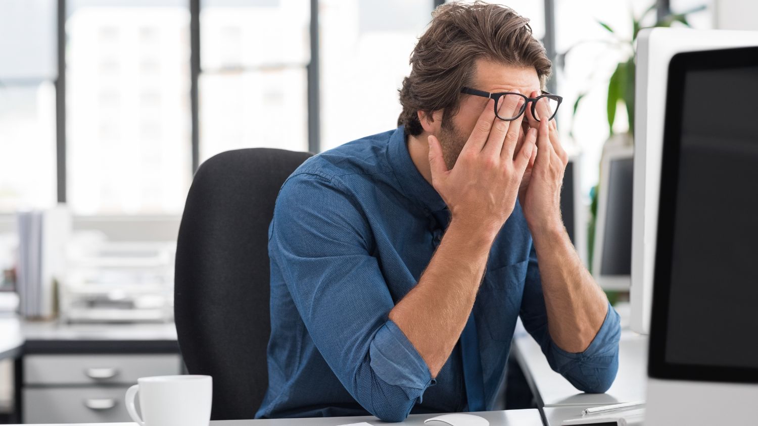 Overwhelmed business owner struggling to manage DIY marketing and daily operations at the same time