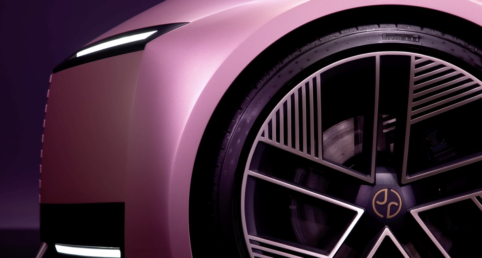 Close-up of Jaguar concept car's wheel with a futuristic design and premium detailing, featuring Pirelli tires. Represents luxury and performance