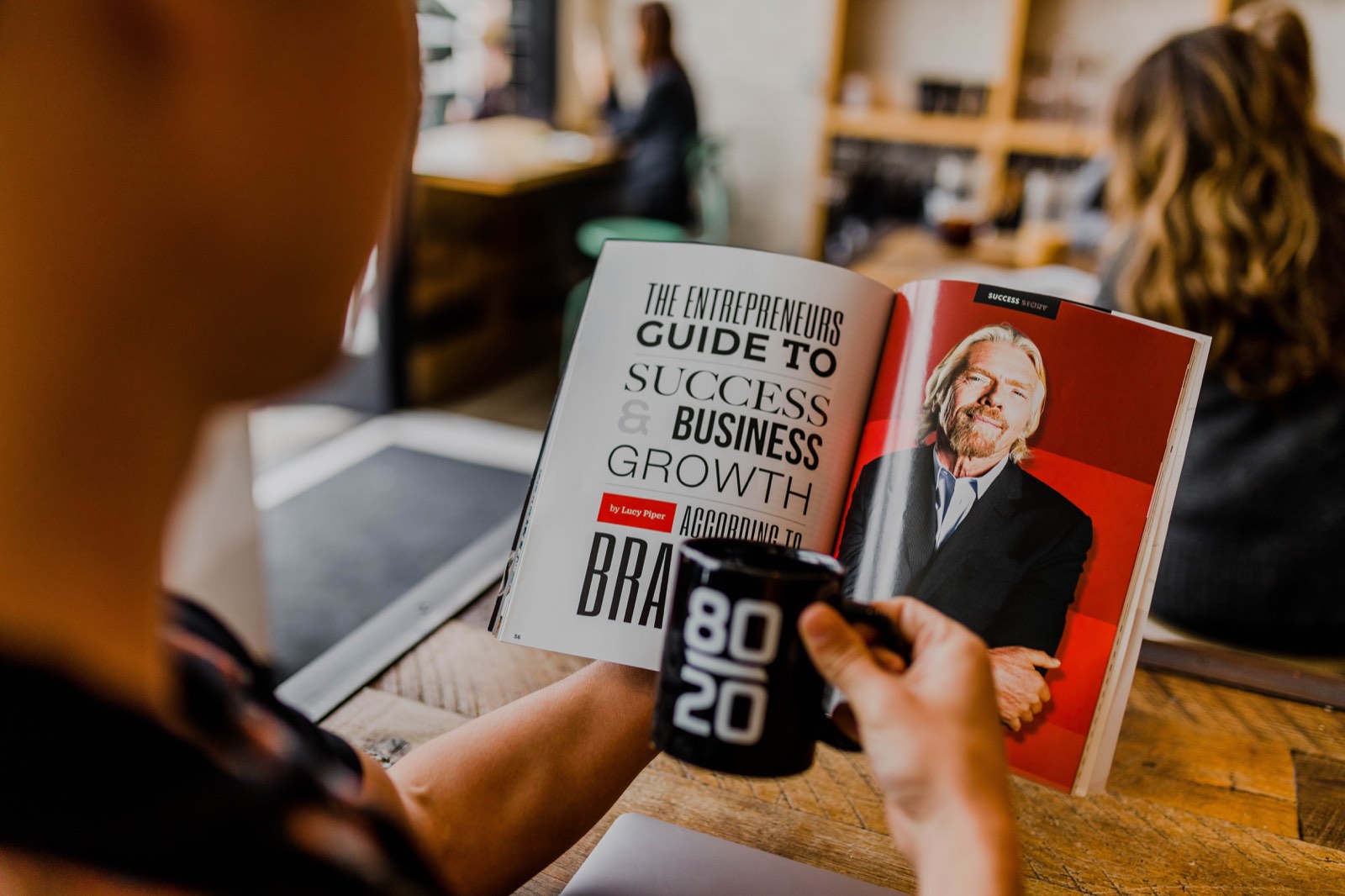 holding magazine of richard branson successful entrepreneur