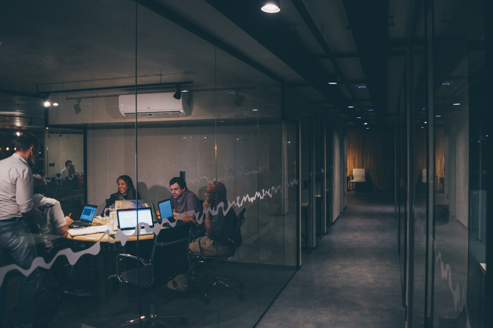 group of people working late in office on digital marketing